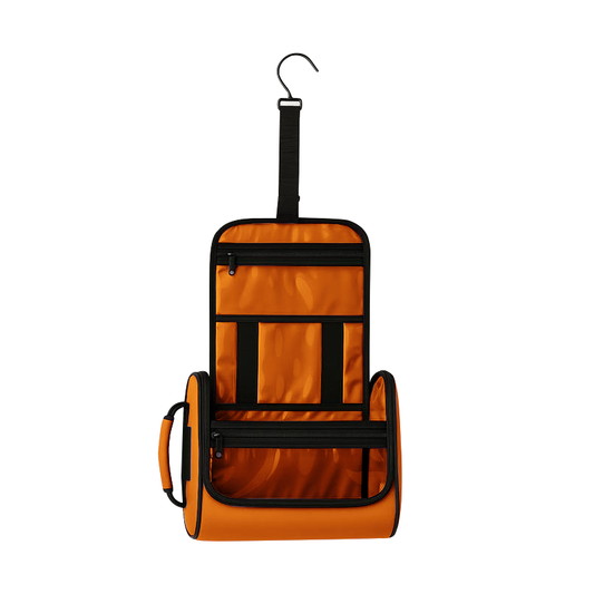 Orange hanging pet toiletry organizer with black zippers, clear vinyl pockets, and a metal hook.