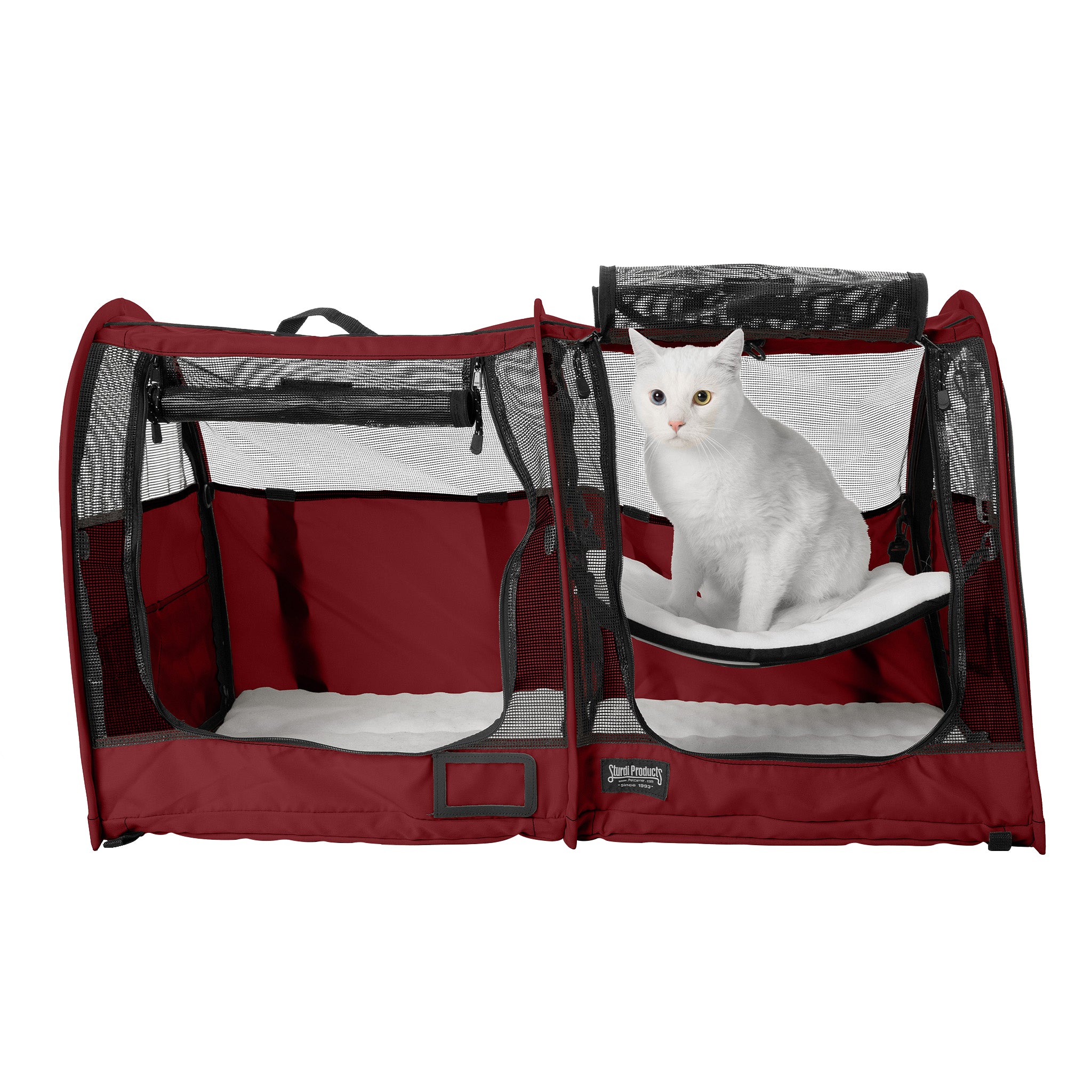 Red CarGo double pop-up kennel with mesh doors, a white cat on a hammock, and white interior pads.