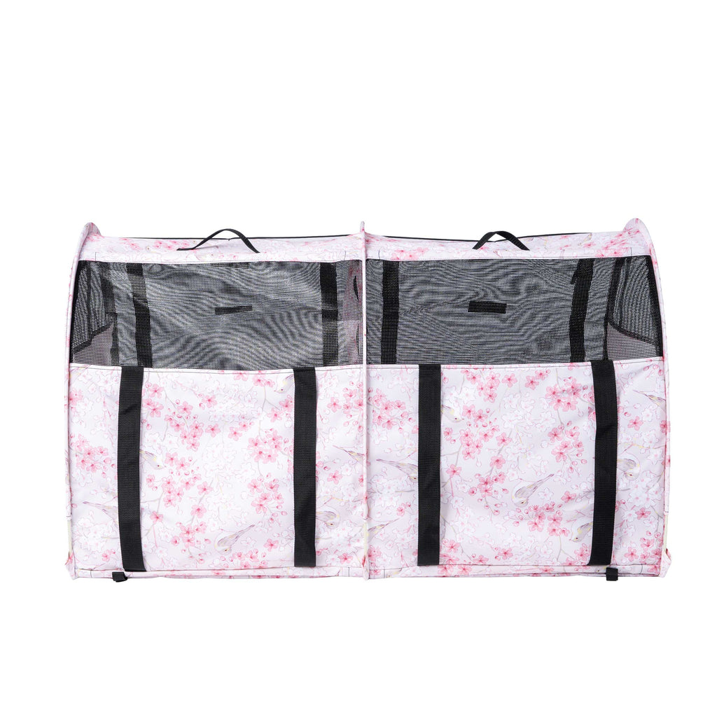 Pink floral CarGo double pop-up kennel with black mesh doors, handles, and straps, for pets.