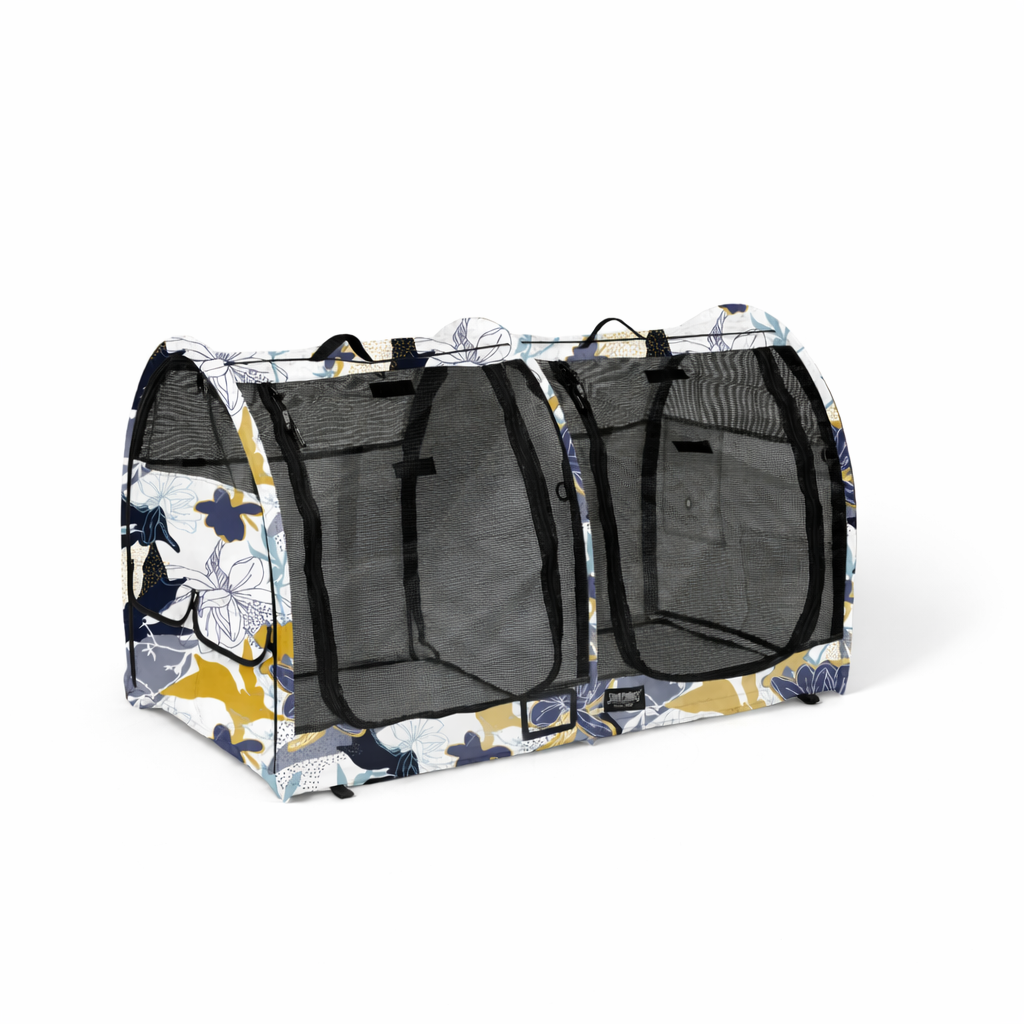 CarGo Double Pop-Up Kennel with blue, yellow, and white floral pattern, mesh doors, and black handles.
