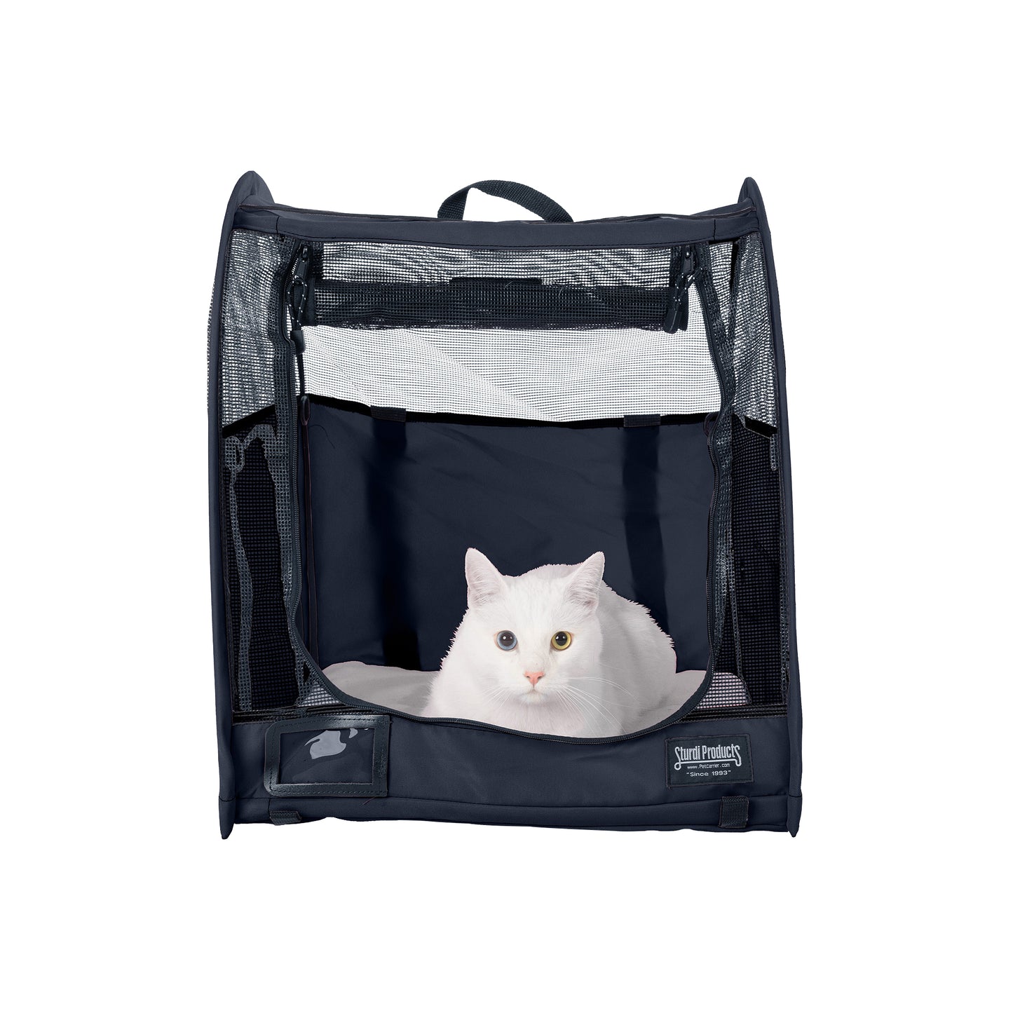 White cat in a dark blue CarGo Pop-Up Kennel with mesh doors, made from durable polyester fabric.