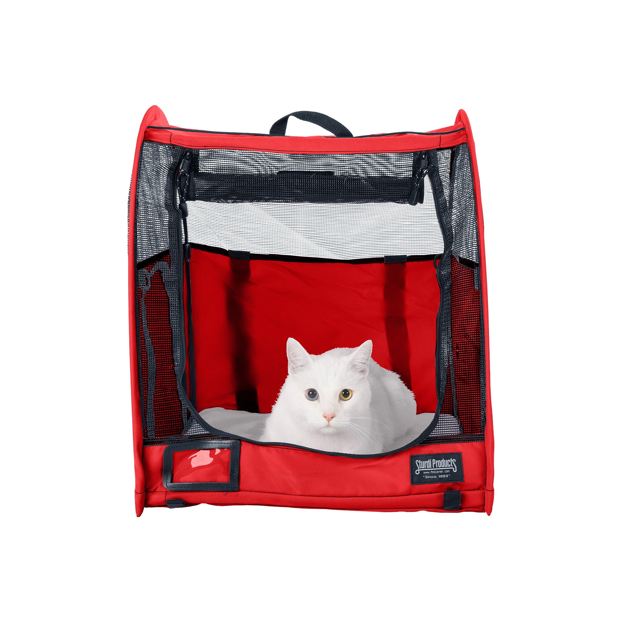 White cat in a red CarGo Portable Pop-Up Kennel with mesh doors and a black handle.