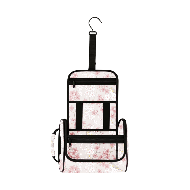 Sakura Nest hanging toiletry bag with pink cherry blossoms, black zippers, and a hook.