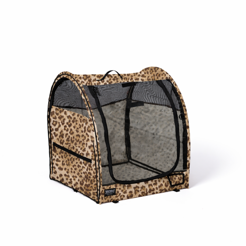 Wild Savannah Champion Pop-Up Kennel: leopard print fabric, black mesh windows, zippered entry, portable design.