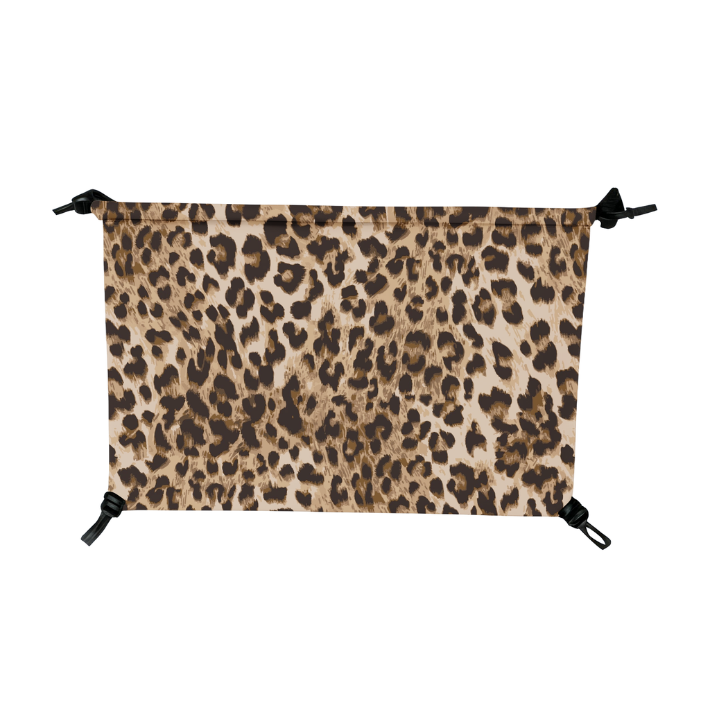 Wild Savannah leopard print fabric hammock cover with black elastic cords and toggles on all four corners.