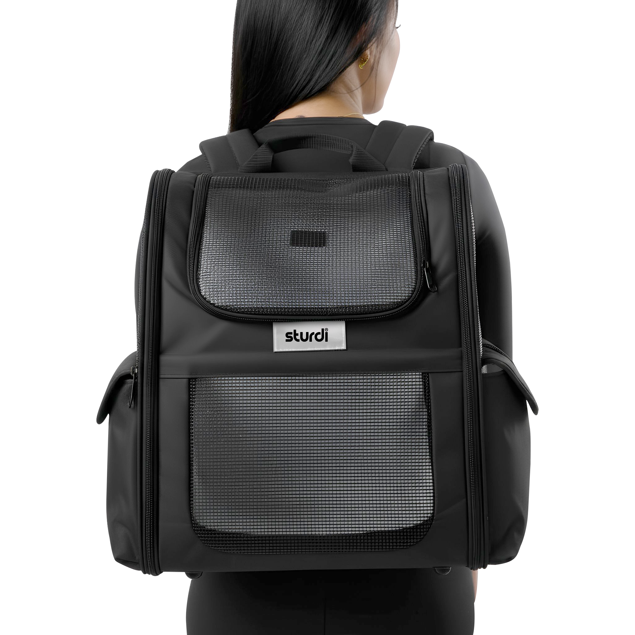 Black Sturdi pet backpack with mesh panels, worn by a person from behind.