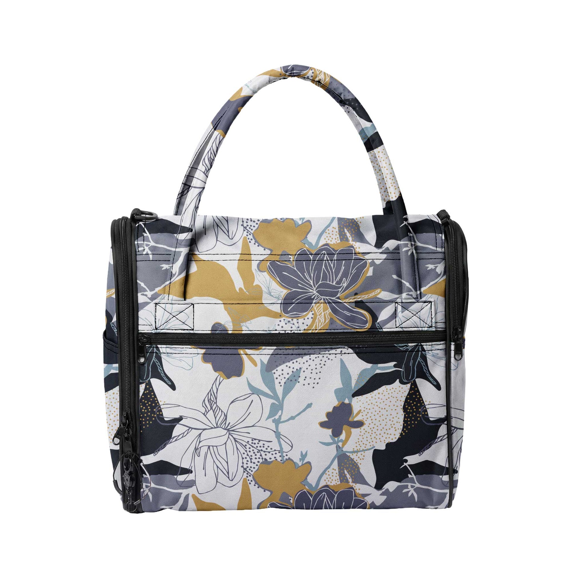 Stylish Incognito pet travel tote with a gray, yellow, and blue floral pattern, black zippers, and top handles.