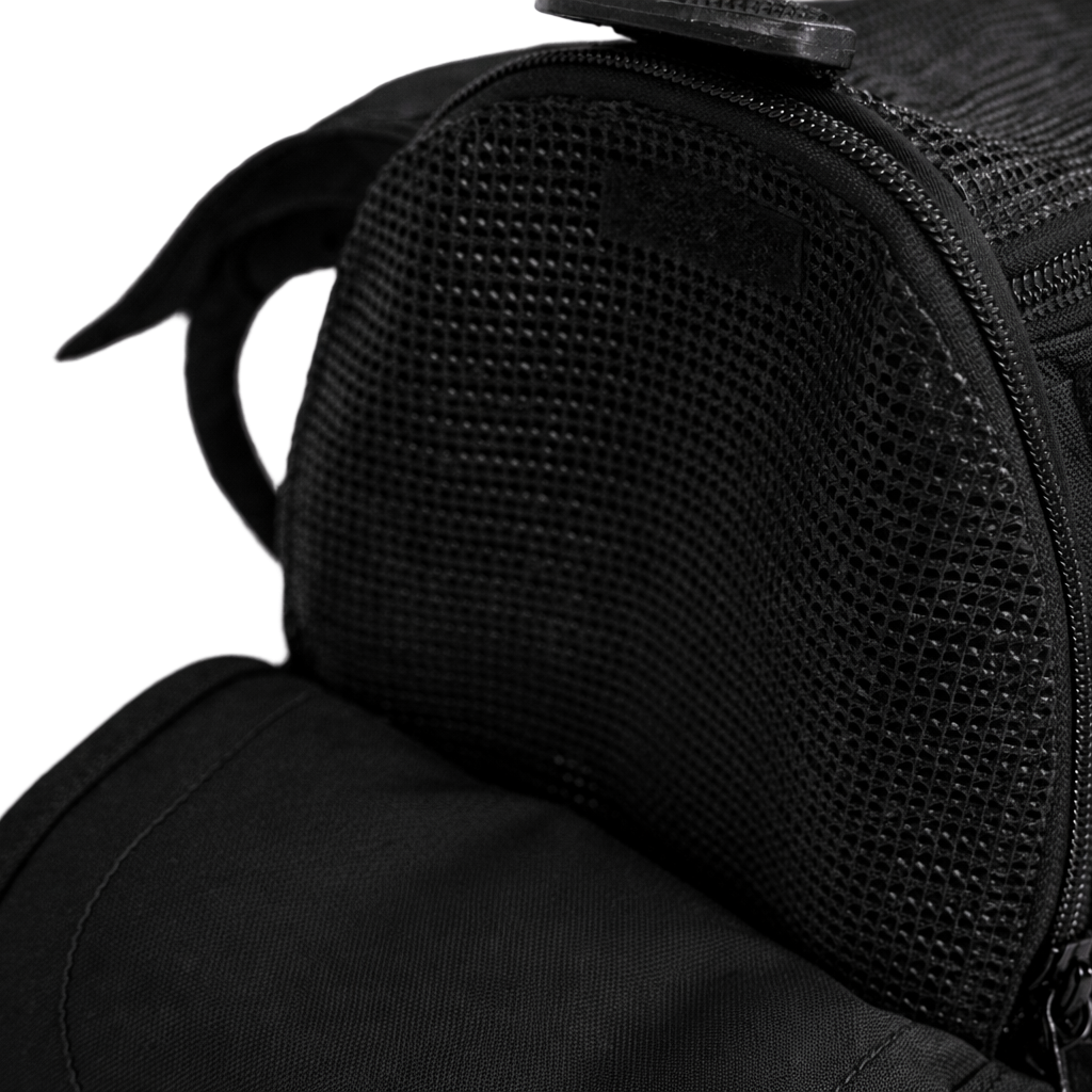 Close-up of a black Incognito pet travel tote, showing the mesh ventilation and zipper opening.