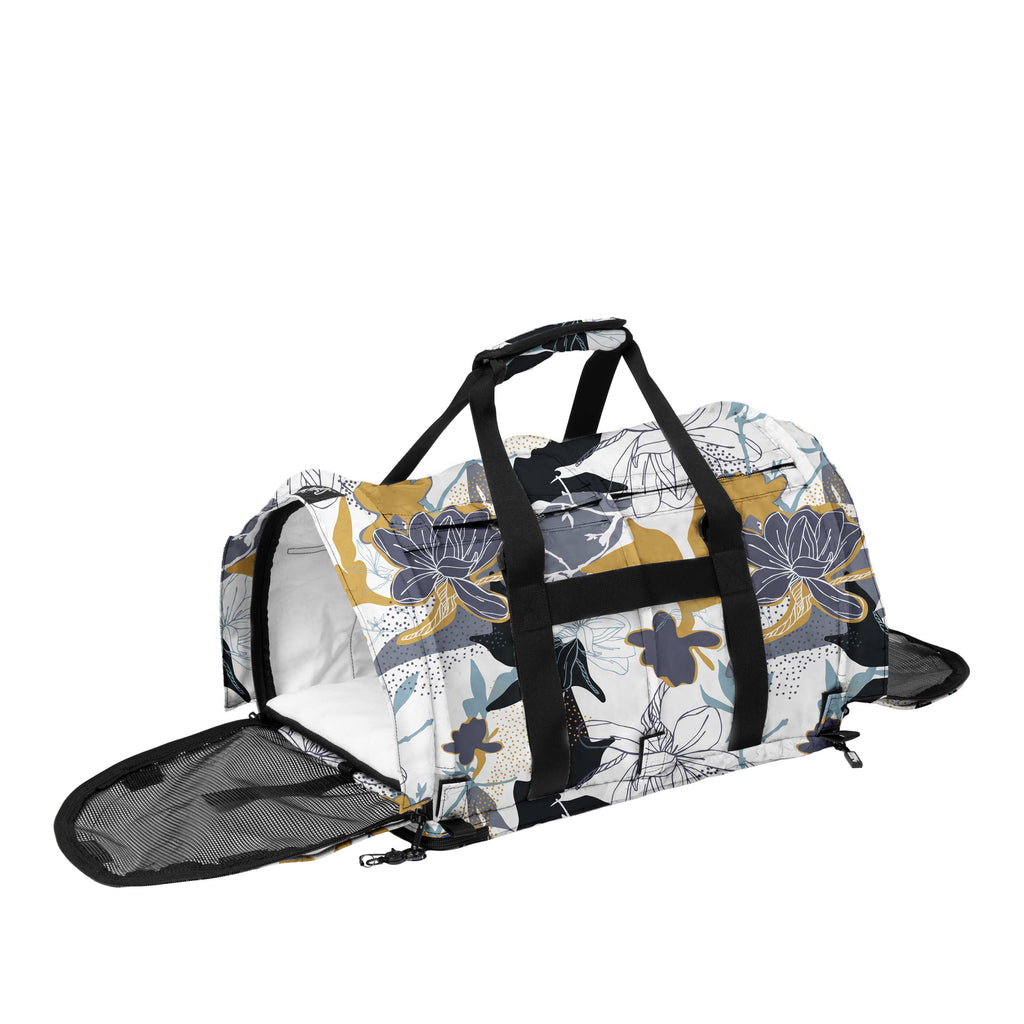 Midnight Bloom SturdiBag Pro 3.0 pet carrier with a white, black, gold, and blue floral pattern.