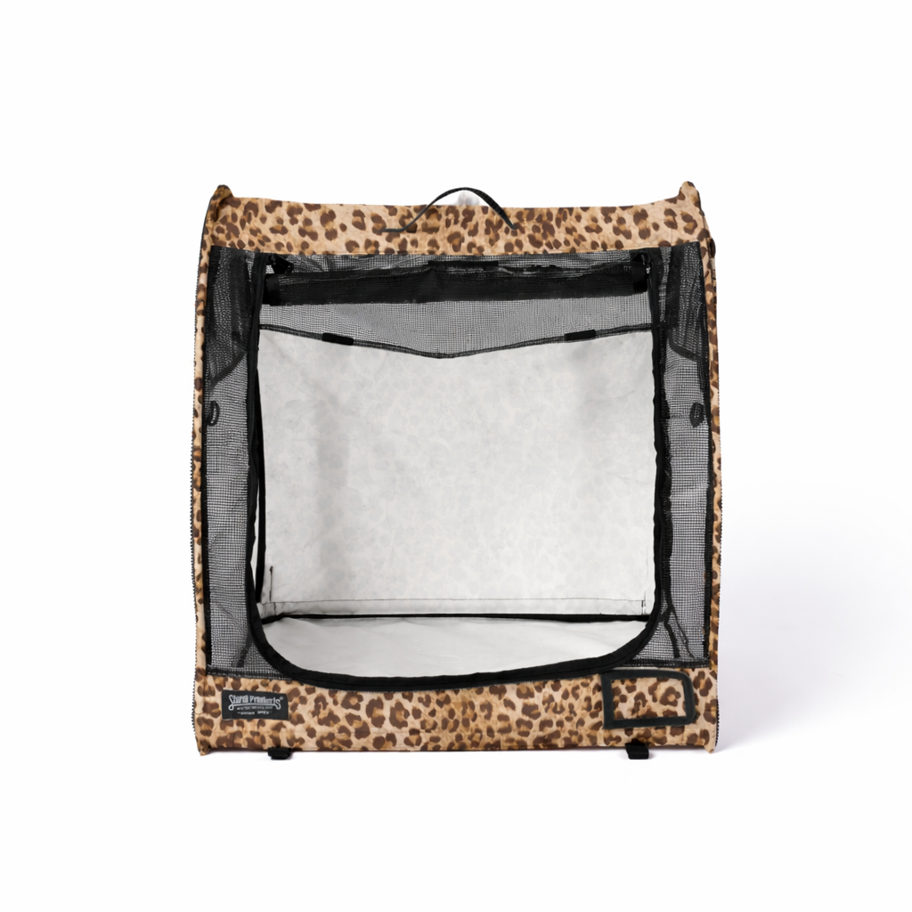 Leopard print modular pop-up pet kennel with black mesh door and sides, ready for travel.