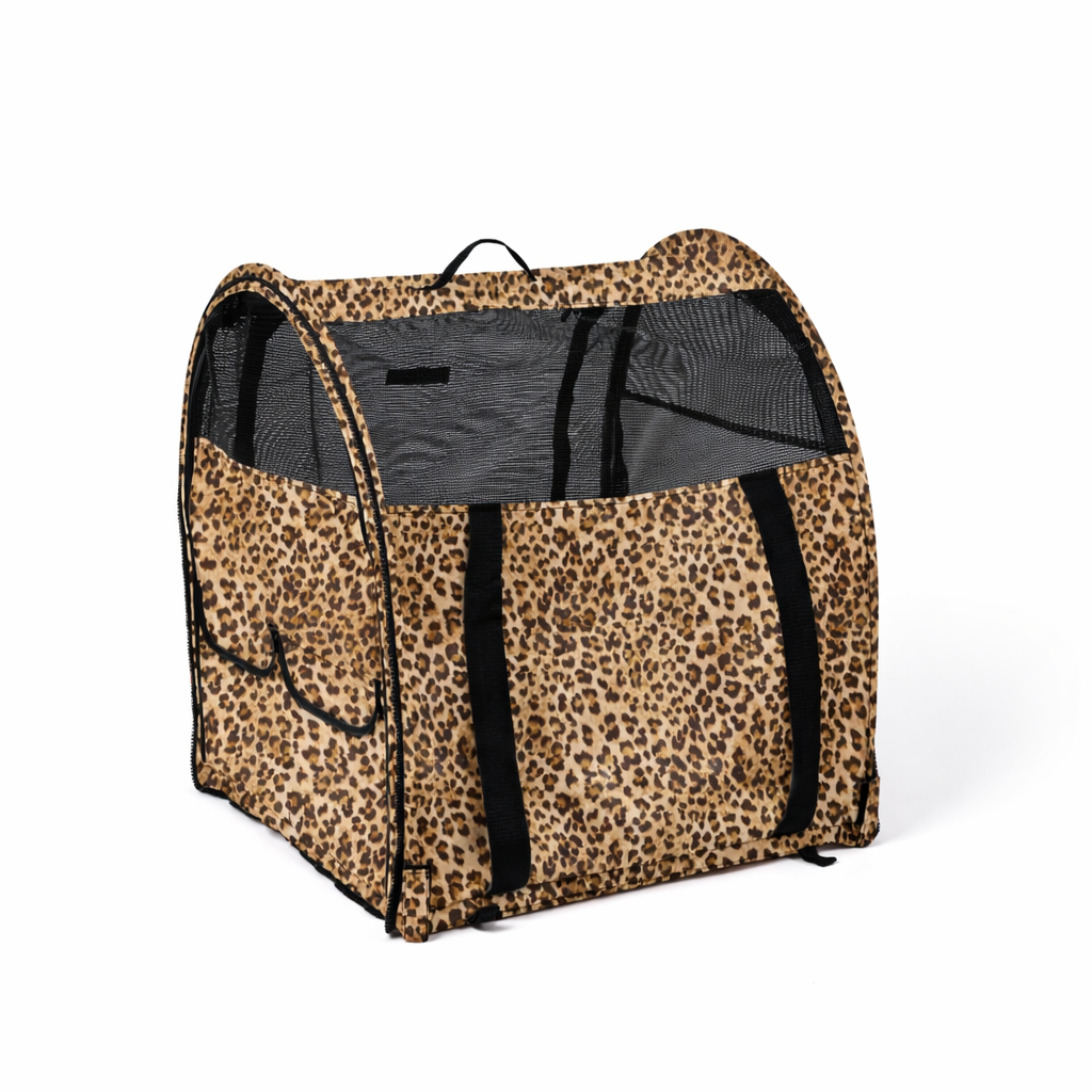 Leopard print modular portable pop-up kennel with black mesh windows and carrying straps.