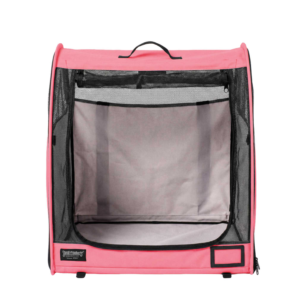 Pink Sturdi Products pop-up kennel with black mesh sides, top handle, and zippered modular design.