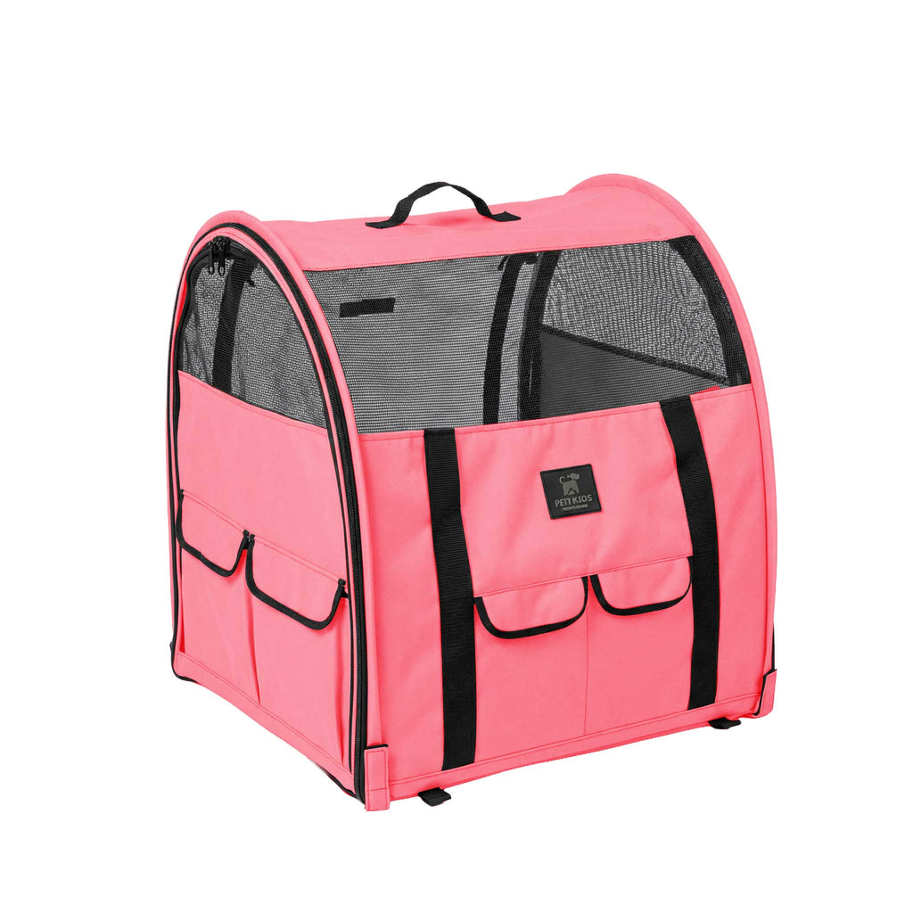 Pink modular portable pop-up kennel with mesh doors, black trim, side pockets, and carrying handle.