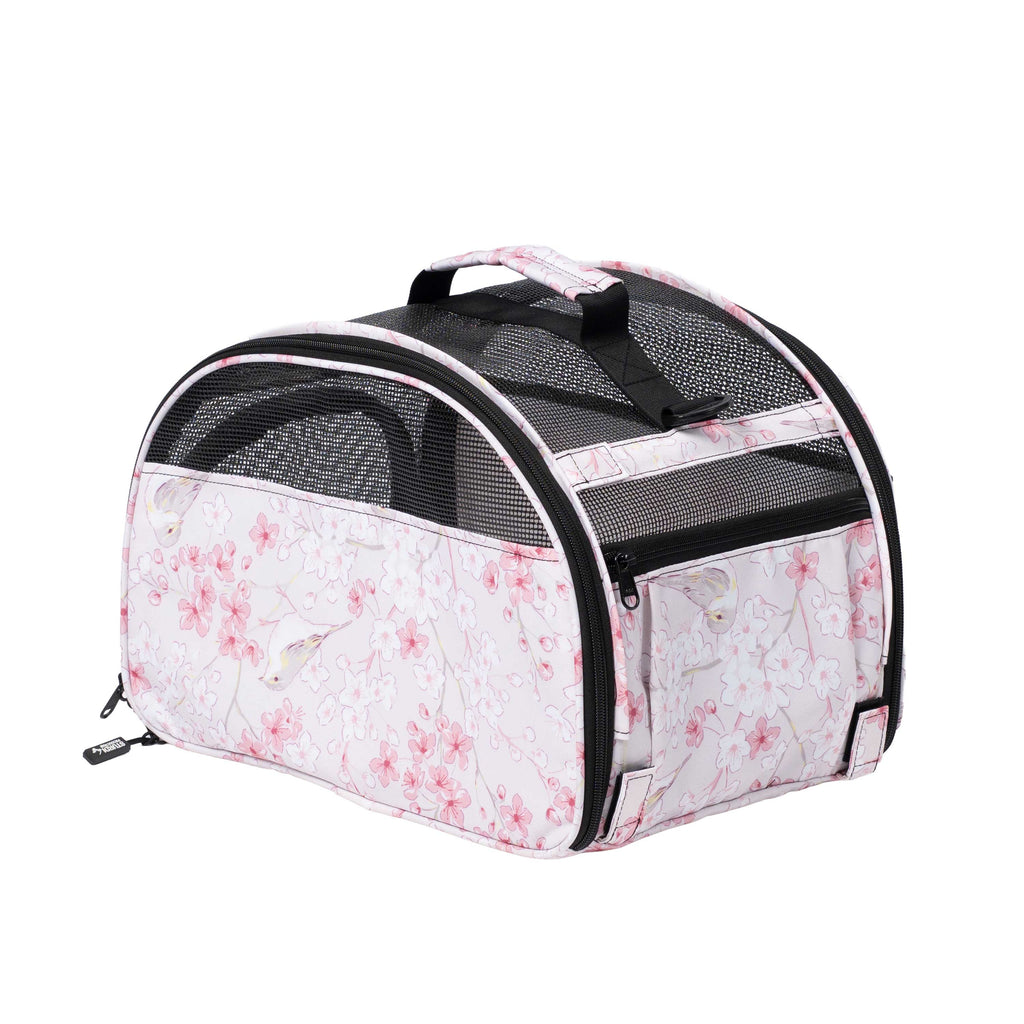 Pink floral Totes'ter compact pet carrier with black mesh, top handle, and side zipper.