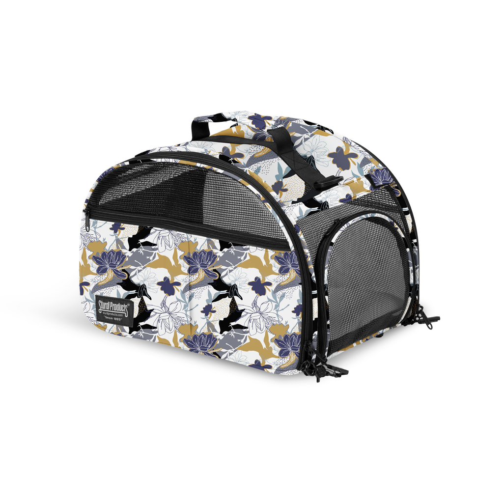 Limited Edition Tote'ster compact pet carrier with white, gold, and blue floral print, mesh panels, and top handle.