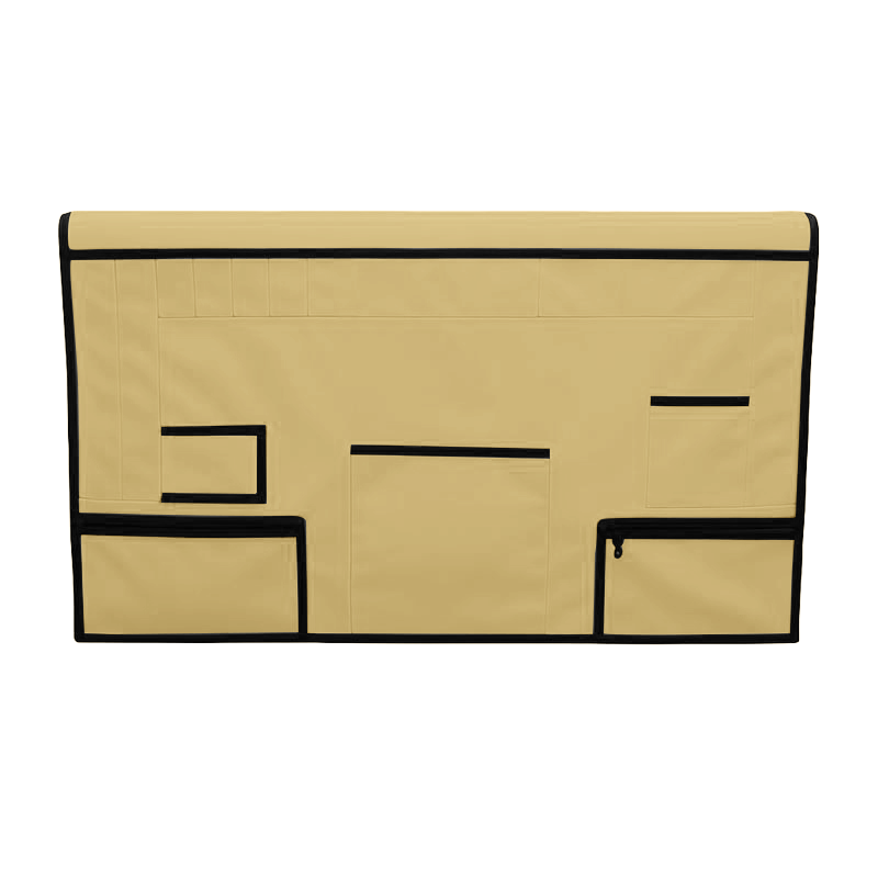Tan pet grooming table skirt with black trim, multiple storage pockets, and zippered pouches.