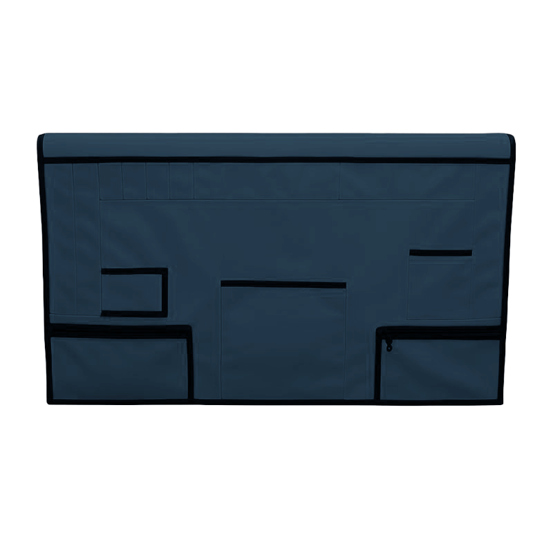 Navy blue pet grooming table skirt with multiple storage pockets and black trim.