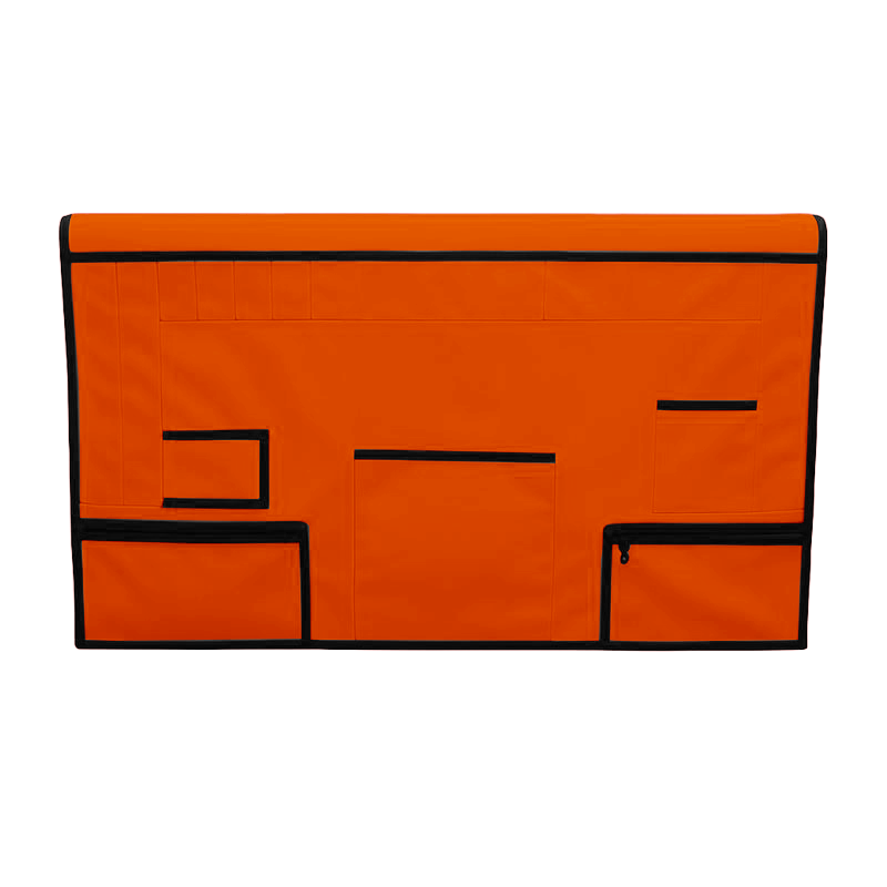 Orange pet grooming table skirt with black trim, multiple pockets, and zippered pouches.