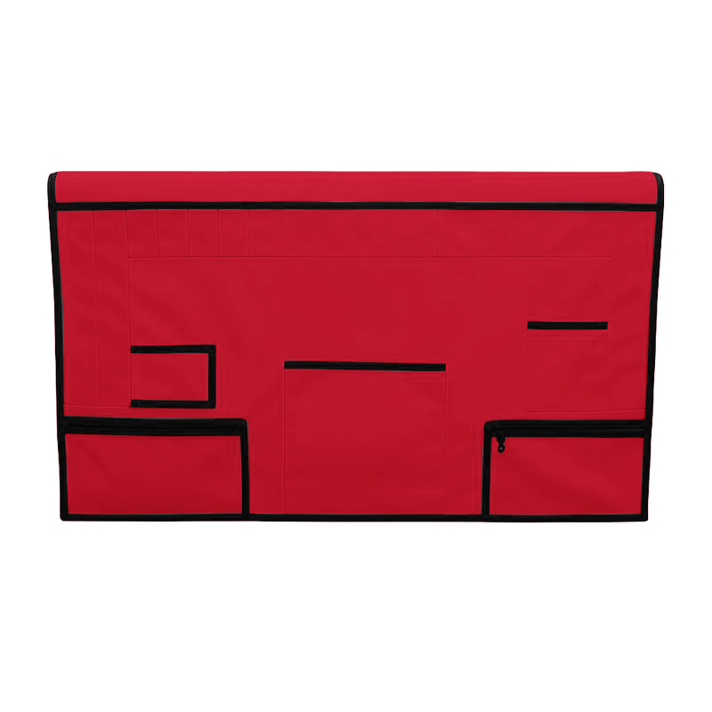 Red pet grooming table skirt with black trim, multiple pockets, and zippered pouches.