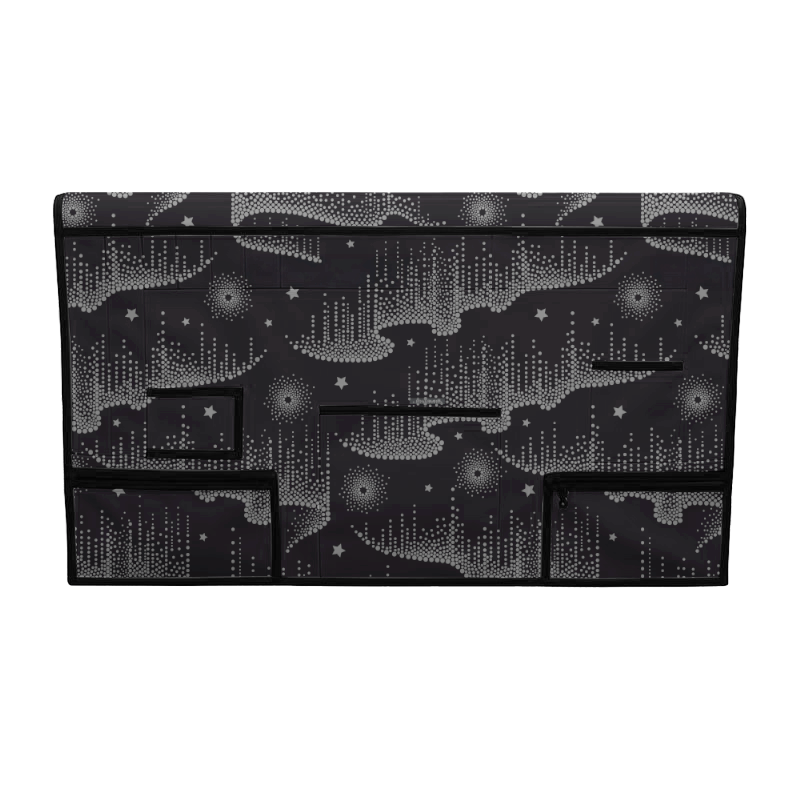 Black grooming table skirt with white star and dot pattern, featuring multiple storage pockets.