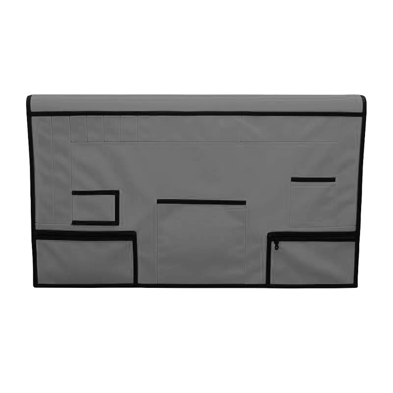 Gray pet grooming table skirt with multiple pockets, including zippered pouches and a clear vinyl sleeve.