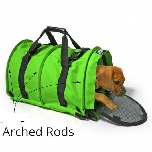 Brown puppy peeking from a bright green SturdiBag pet carrier, highlighting the arched support rods.