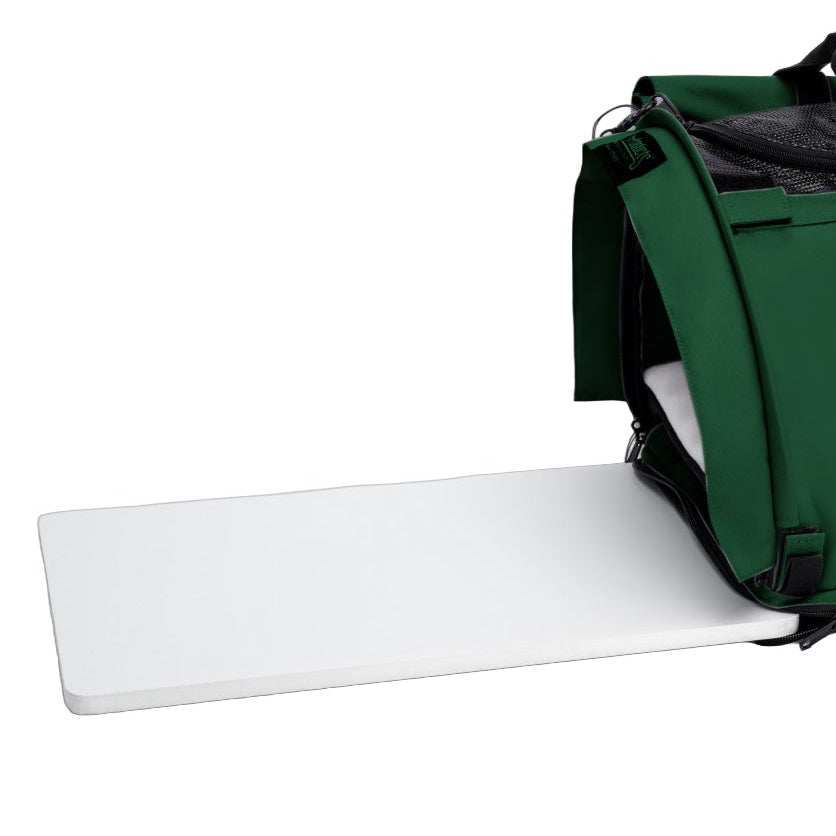 White foam core replacement base board sliding into a green SturdiBag pet carrier.