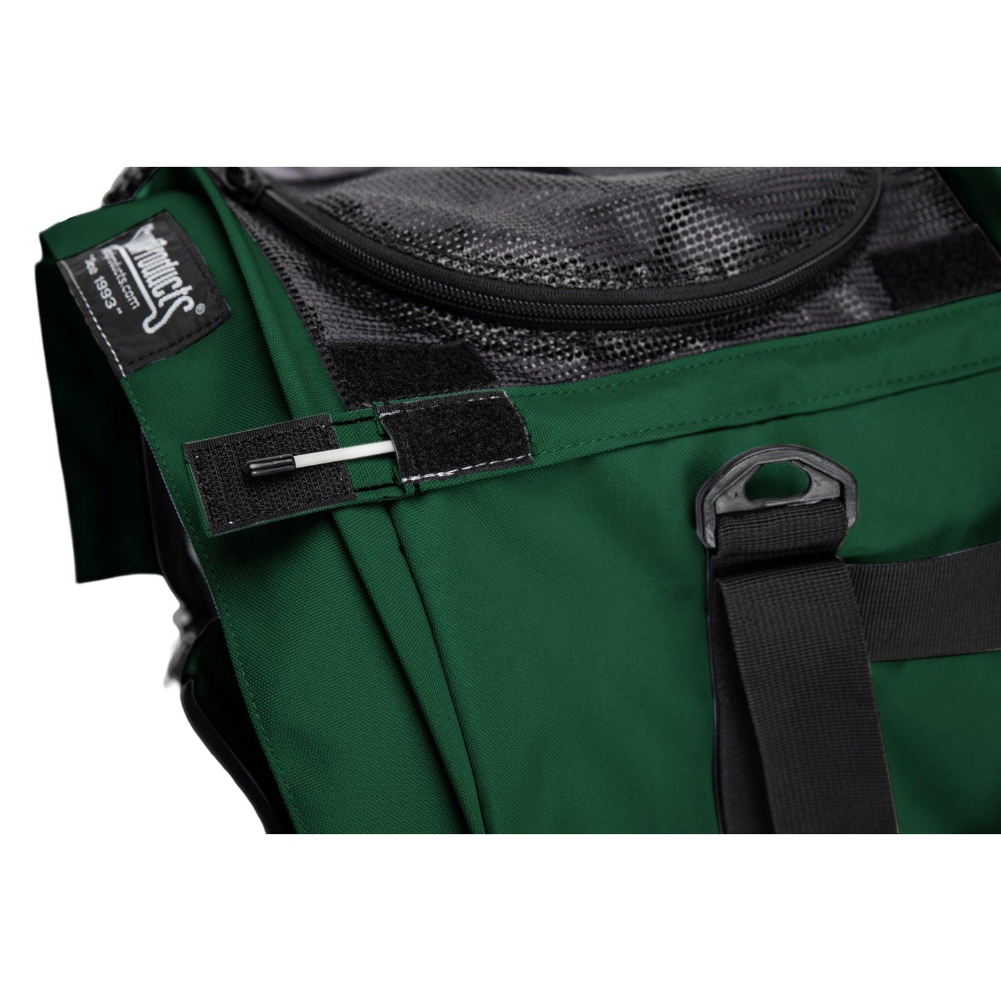 White replacement horizontal rod for a green SturdiBag pet carrier, shown partially inserted into a black fabric loop.