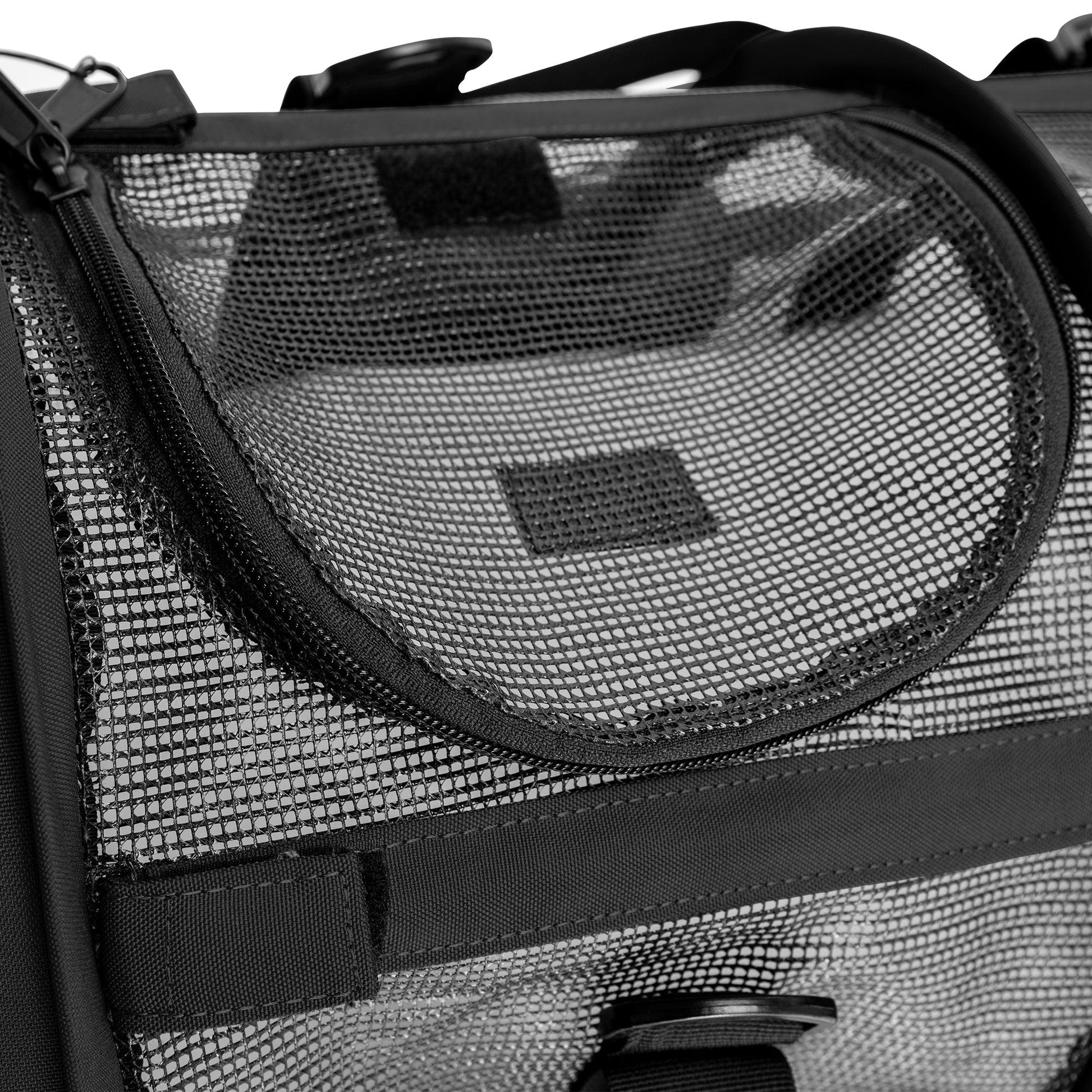 Close-up of a black SturdiBag All Mesh Pet Carrier, showing the breathable mesh panels and zipper.