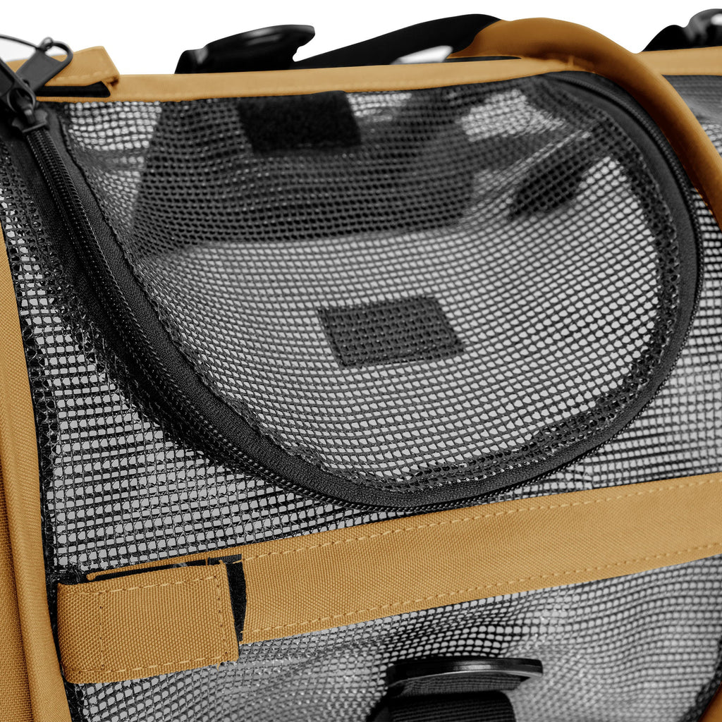 Close-up of a tan and black SturdiBag All Mesh Pet Carrier with a zippered mesh opening.