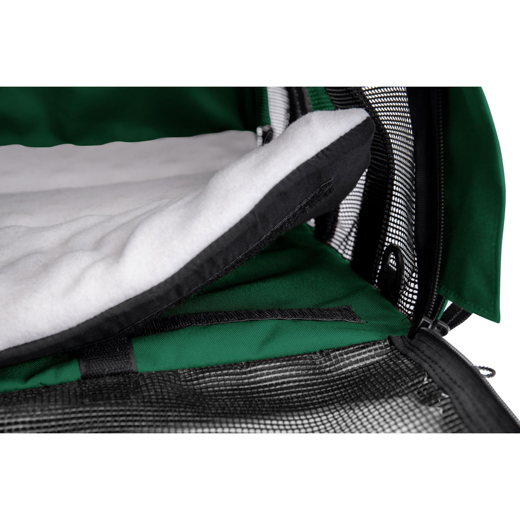Green SturdiBag Pro 3.0 divided pet carrier with a soft white fleece pad and black mesh panels.