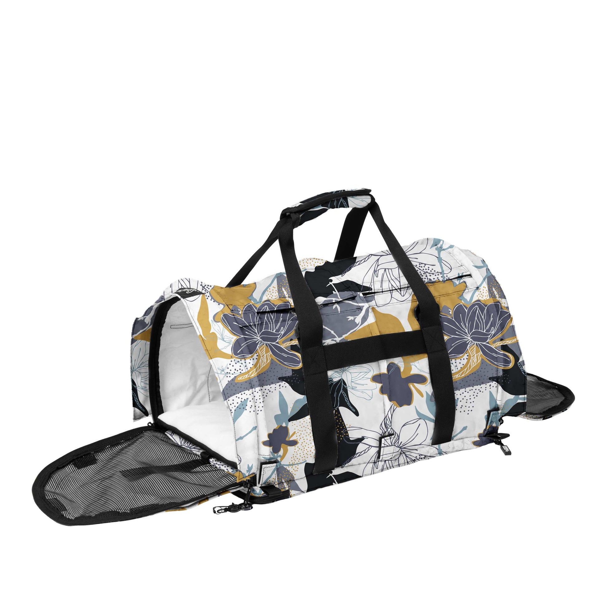 SturdiBag Pro 3.0 soft-sided pet carrier with a white, blue, and gold floral pattern, mesh panels, and black straps.