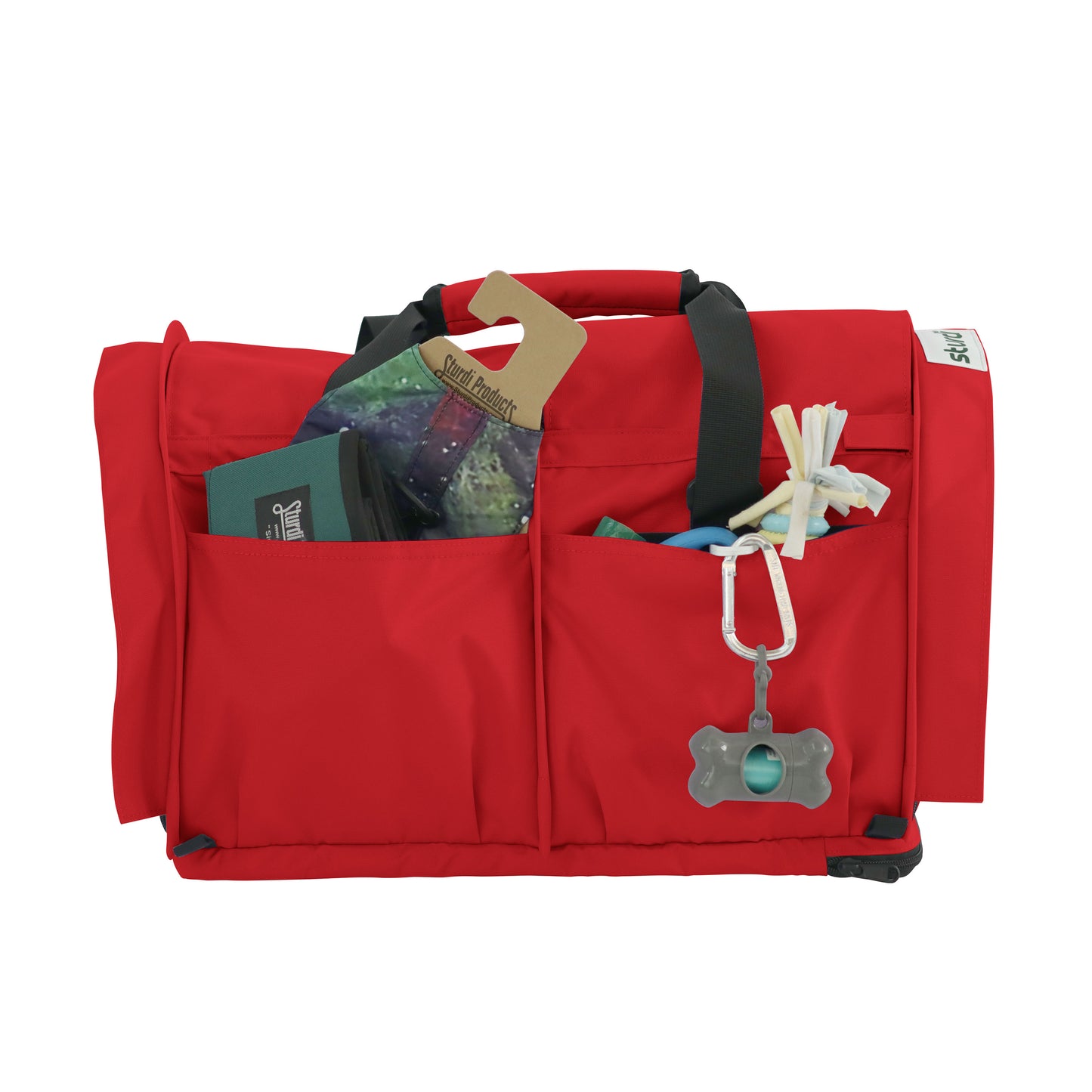 Red SturdiBag Pro 3.0 pet carrier with mesh pockets holding pet essentials and a bone-shaped dispenser.