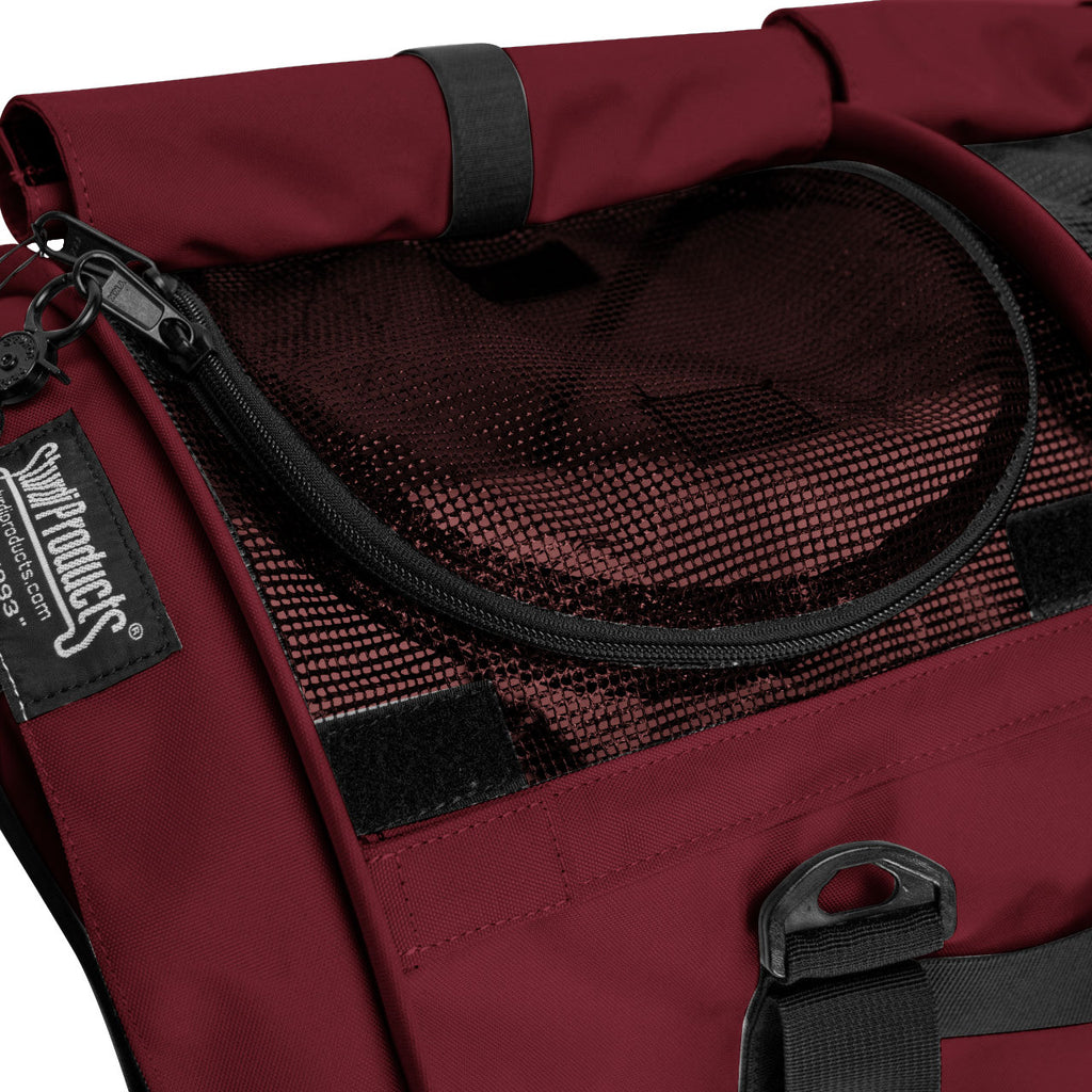 Close-up of a burgundy SturdiBag Pro 3.0 pet carrier with black mesh top and zipper.