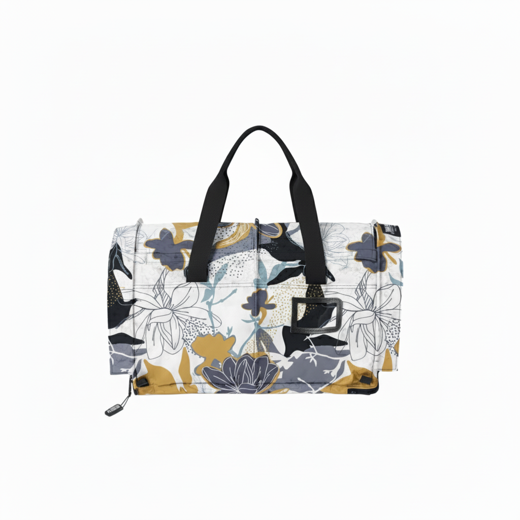 SturdiBag Pro 3.0 pet carrier in a white, gold, and grey floral pattern with black handles.