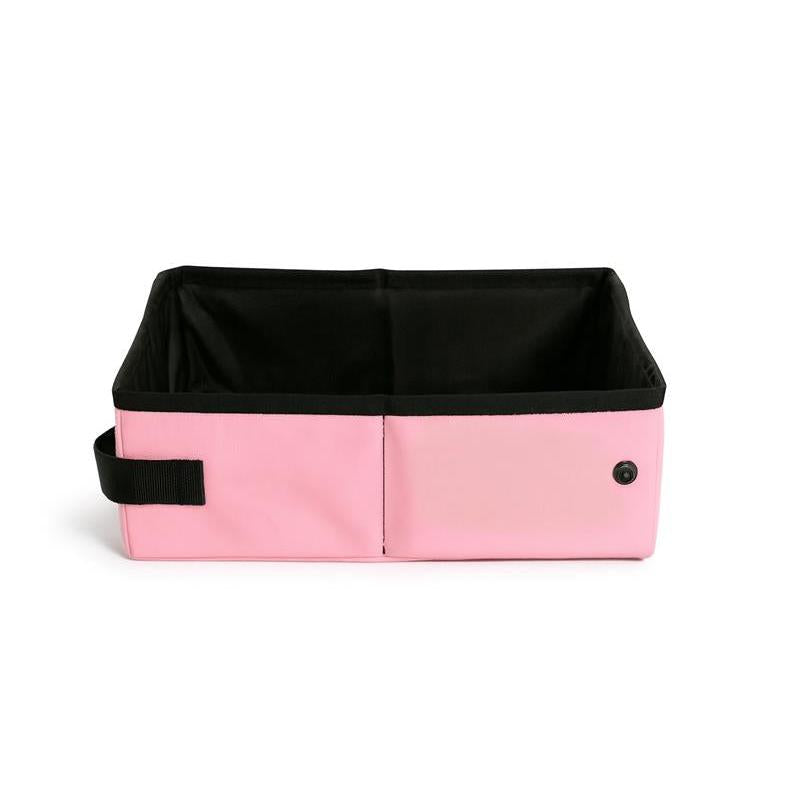 Pink SturdiBox portable litter box, collapsed flat, with a black interior and strap.