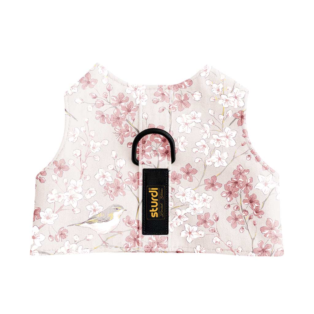 Pink and white cherry blossom pet walking vest with a bird print and black D-ring.