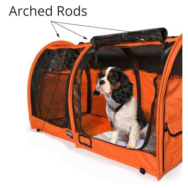 Cavalier King Charles Spaniel inside an orange pop-up kennel with black mesh windows and arched rods.