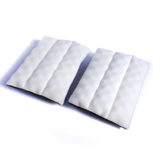 Two white, plush fleece comfort pads with quilted channels for SturdiBag Divided Pet Carriers.